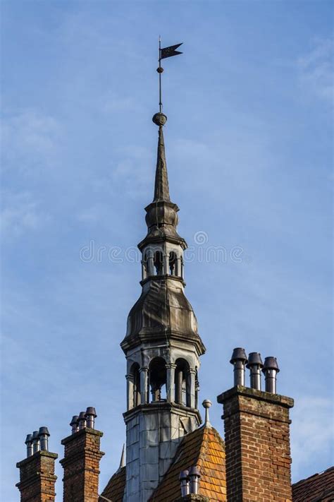 Detail Of A Old Building With A Big Tower With Vane On The Roof On A