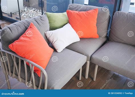 Modern Grey Sofa With Pillows In Living Room At Home Stock Photo