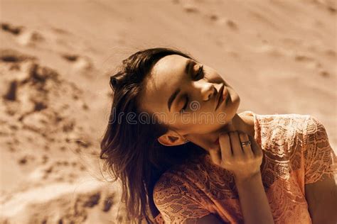 Girl With Closed Her Eyes And Opened Mouth Keeps Hand On Face Stock