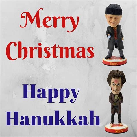 Two Bobble Heads On Top Of Each Other With The Words Merry Christmas