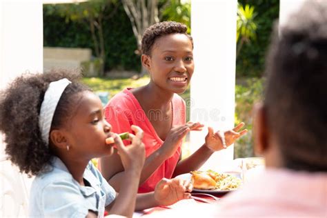 African American Woman Talking With Her Mother And Daughter During A