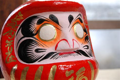 The Takasaki Daruma Doll Merlion Wayfarer Goes World