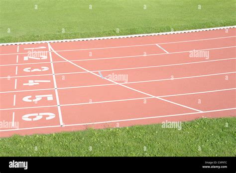 Athletic sports field running track starting line Stock Photo - Alamy