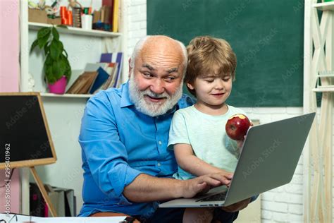 Grandfather talking to grandson. Learning and education concept ...