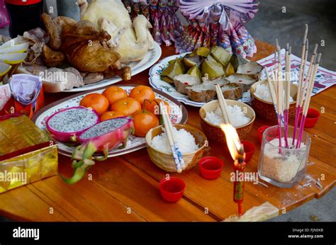 People Putting Sacrificial Offering Food For Pray To God And Memorial