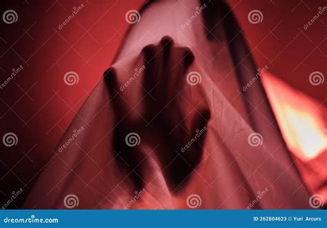 Hand Fabric And Red With A Person Under A Sheet In A Bedroom Or Studio