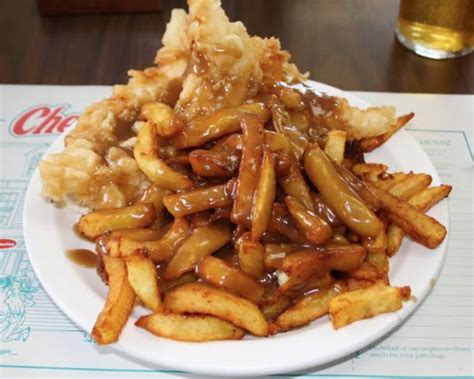 Canadian Poutine-French Fries smothered in gravy and cheese curds. The ...