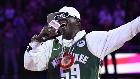 Rap legend Flavor Flav leaves fans divided with national anthem rendition at NBA game as fans ...