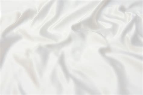 Premium Photo | Texture of ivory or white silk fabric. Background, pattern.