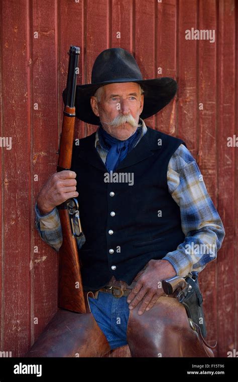 Man Cowboy Rifle Hi Res Stock Photography And Images Alamy