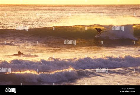 Surfing in Jersey Channel Islands Stock Photo - Alamy