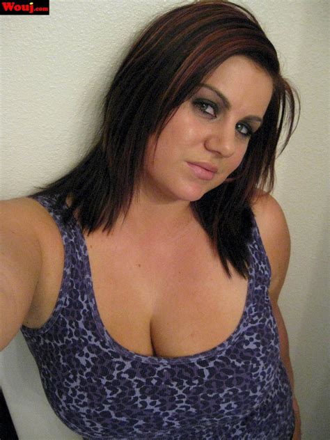 Hot Brunette Chick Loves Teasing With Her Big Cleavage Photos