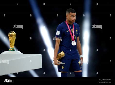 Frances Kylian Mbappe Walks Past The Fifa World Cup Trophy After Being