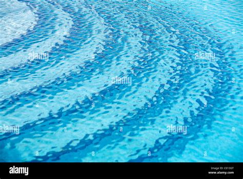 Rippled Water Surface In A Swimming Pool Detail Blue With Steps Below