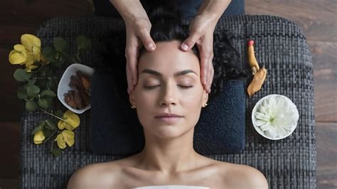 Premium Photo Young Woman Receiving A Head Massage In A Spa Center