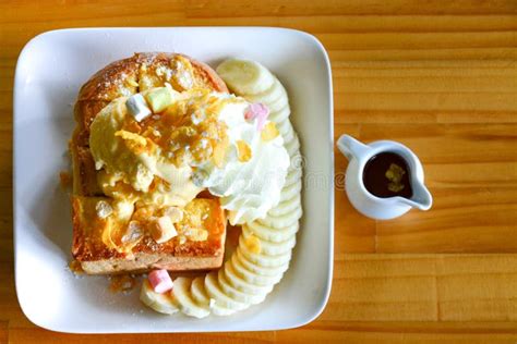 Honey Toast With Vanilla Ice Cream And Marshmallow On Whipped Cream