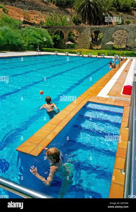 The municipal swimming pool in the hill village of Torrox, on the Stock ...