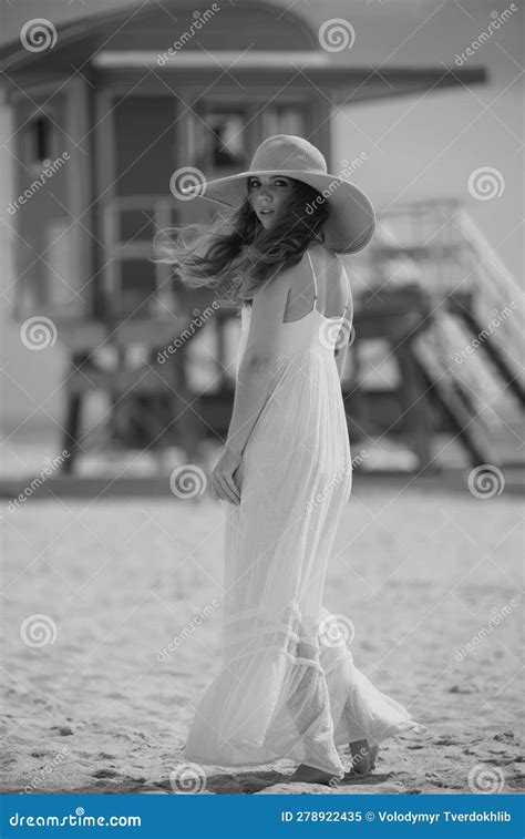 Beautiful Girl With Straw Hat Enjoying Sunbath At Beach Young Tanned