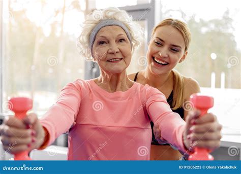 Cheerful Grandmother Making Exercises In Gym Stock Image Image Of