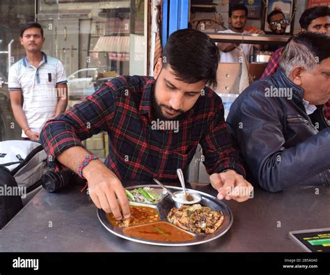 Delhi Street Food Person Eating Naan Or Amritsari Chur Chur Naan Of