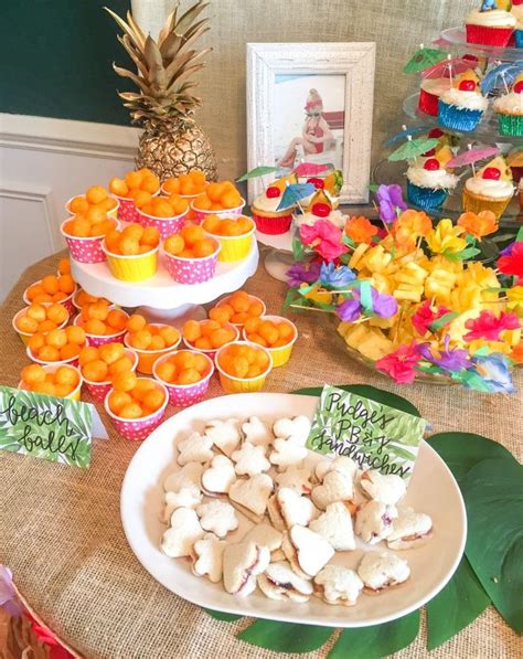 There Are Many Cupcakes And Oranges On The Table