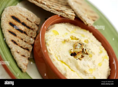 Roasted Garlic Houmous And Pitta Bread Stock Photo Alamy