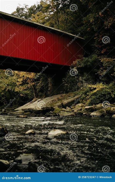 Red Bridge Over Flowing River Stock Image - Image of travel, river ...