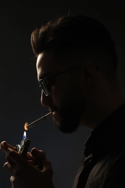 Premium Photo Close Up Of Man Smoking Cigarette