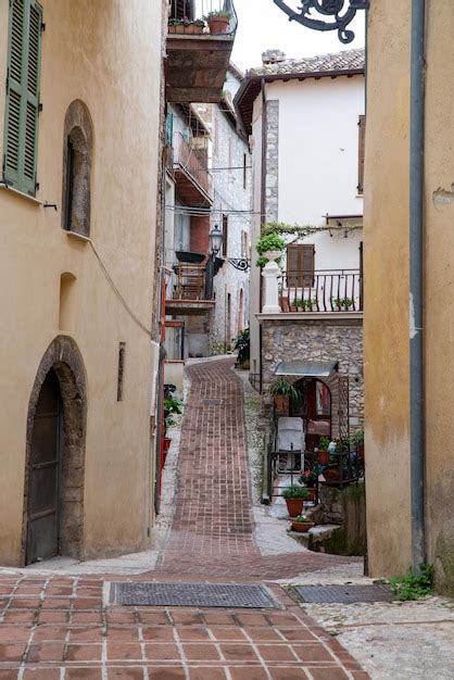 Premium Photo Narrow Alley Amidst Buildings In Town