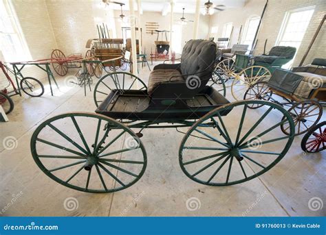 A Horse And Buggy Carriage With Coachman In Central Park New York City