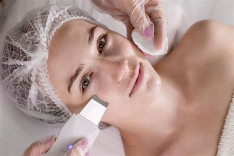 Cosmetologist Beautician Making Facial Treatment With Ultrasonic