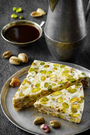 Turkish Pistachio Dessert With A Some Of Pistachios And Coffee Stock ...