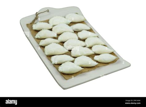 Varenik before cooking board on a white background. Ukrainian cuisine ...