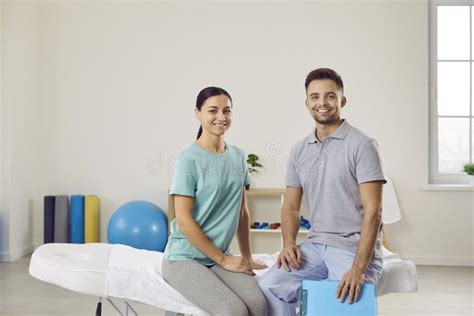 Portrait Of Happy Patient With Professional Chiropractor Osteopath