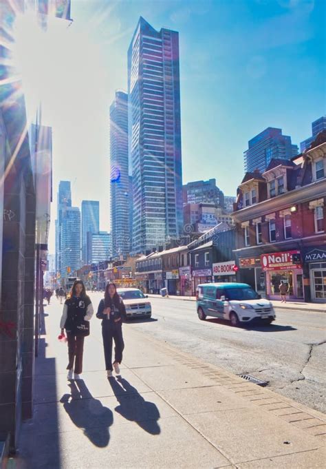 People On Sidewalk Of Toronto City Shopping Street Editorial