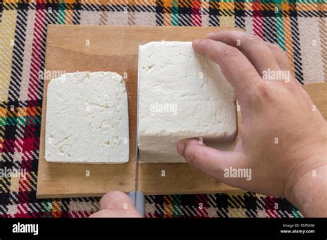 Cutting Traditional Bulgarian Salty White Cheese With A Knife First