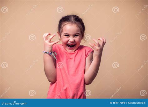 A Portrait Of Evil Kid Girl Children And Emotions Concept Stock Photo