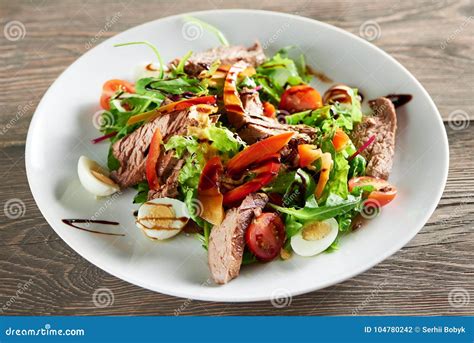 Delicious Food On The Wooden Table Stock Photo Image Of Meal Greens