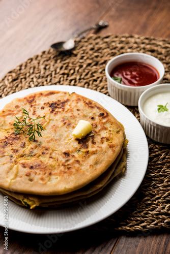 Aloo Paratha Indian Potato Stuffed Flatbread Served With Fresh Curd