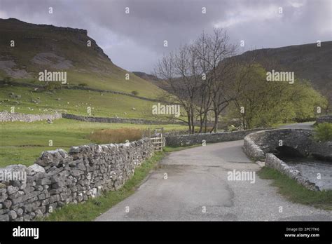 View Of Steep Sided Valley Dry Stone Walls Stone Bridge Trees And