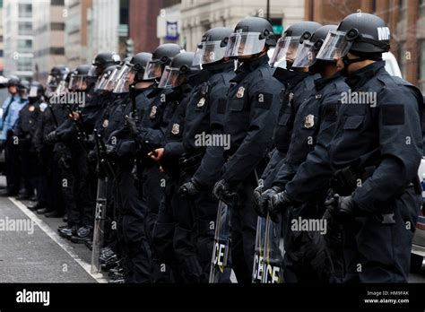 Metropolitan Police In Riot Gear Standing In Formation During Stock