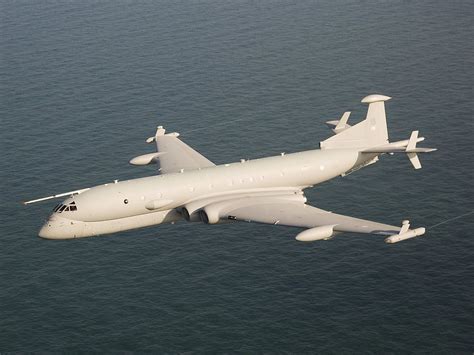 An RAF Nimrod patrols above the waves, with its refuelling nozzle ...