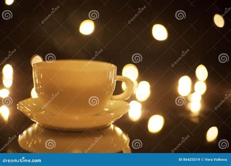 White Cup With Reflection On Glass Lights In Blur On Black Background Stock Image Image Of