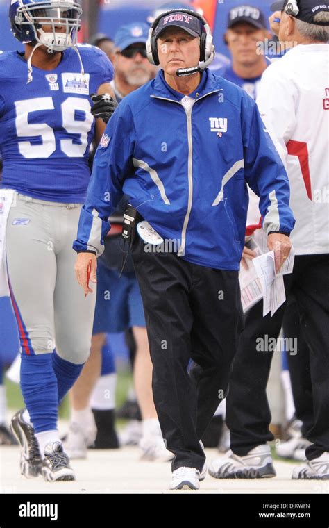 New York Giants Head Coach Tom Coughlin Looks Up At The Scoreboard