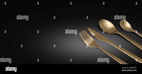 Gold Fork Knife And Spoon Frame Against Open Black Copy Space With