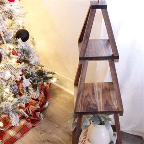 A Christmas Tree With A Wooden Shelf Next To It