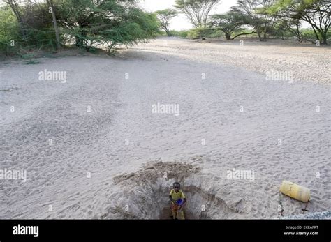 Kenya Turkana Drought And Climate Change Dry River Bed Girl Fetch