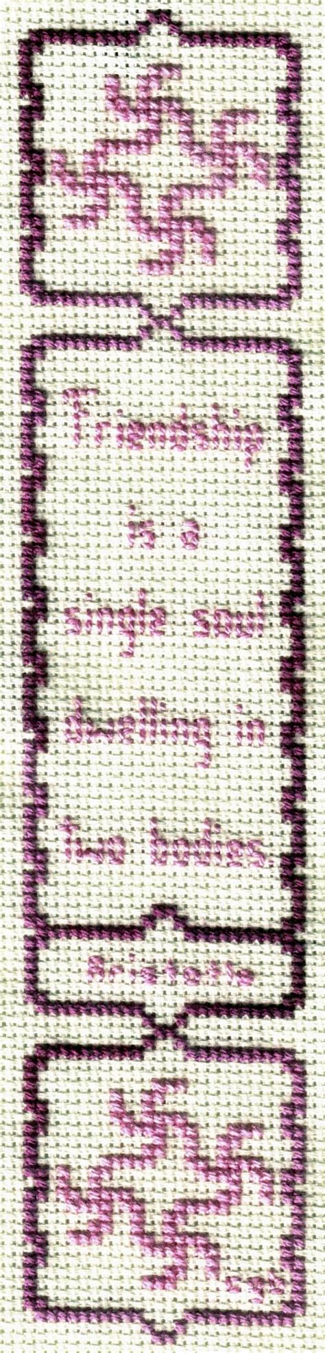 A Cross Stitch Pattern With Purple And White Designs On It S Edges In