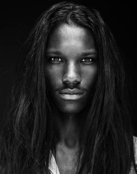 A Black And White Photo Of A Woman With Long Hair