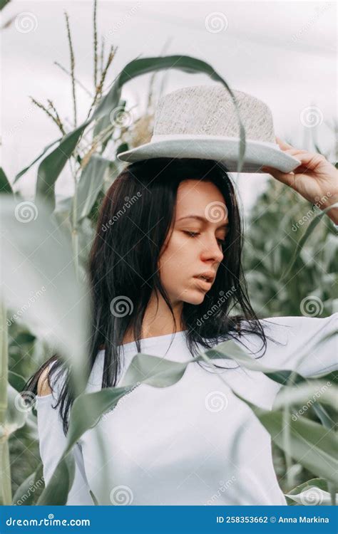 A Brunette Girl In A White Dress In A Cornfield The Concept Of